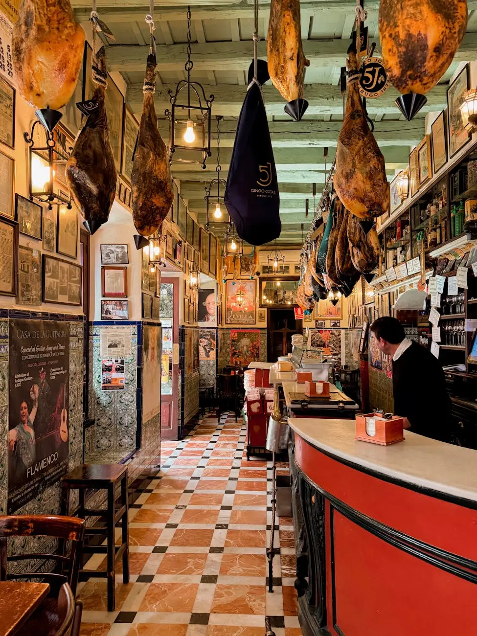 Bar de tapas tradicional en Sevilla con jamones colgando y decoracion tipica andaluza